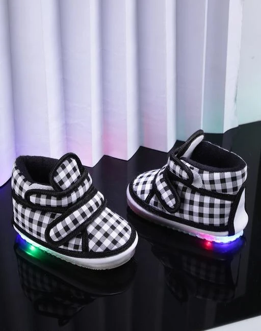 Checkout this latest Casual Shoes
Product Name: *Chiu Kids LED Light Shoes With Musical Chu Chu Sound For Baby Girl And Baby Boys (WhiteBlack ; 18_21 Months ; 7 UK )*
Material: Canvas
Sole Material: PVC
Fastening & Back Detail: Velcro
Pattern: Solid
Multipack: 1
Sizes: 
18-21 Months (Foot Length Size: 14 in) 
Country of Origin: India
Easy Returns Available In Case Of Any Issue


Catalog Rating: ★3.9 (85)

Catalog Name: Designer Latest Boys Casual Shoes
CatalogID_2021561
C57-SC1188
Code: 363-10930614-4221