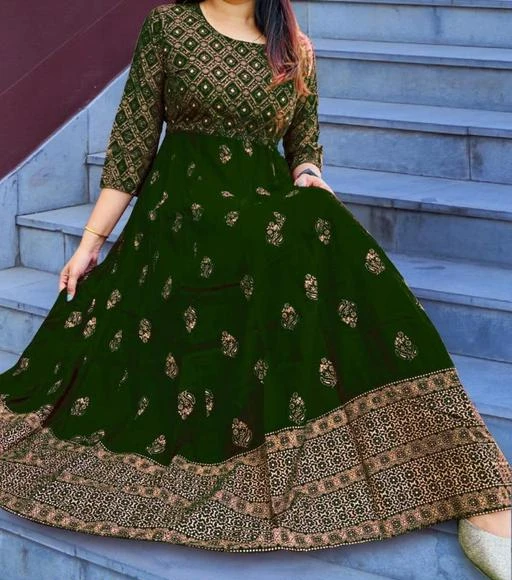 Checkout this latest Gowns
Product Name: *Aishani Superior Royal  Kurtis*
Fabric: Rayon
Sleeve Length: Three-Quarter Sleeves
Pattern: Printed
Net Quantity (N): 1
Sizes:
M (Bust Size: 38 in, Length Size: 54 in) 
L (Bust Size: 40 in, Length Size: 54 in) 
XL (Bust Size: 42 in, Length Size: 54 in) 
XXL (Bust Size: 44 in, Length Size: 54 in) 
XXXL (Bust Size: 46 in, Length Size: 54 in) 
A stylish Flared kurta that is perfect for every occasion, instantly spruces up your wardrobe, which makes it the most versatile piece of ethnic item you can own. Pair it with suitable accessories for a grand look or a simple watch for a wash-and-go everyday look. You can also wear it with appropriate, matching footwear to give an elegant lift.  Fabric : Rayon | Package Contents : 1 Embroidered Solid kurta | latest design party wear gown kurta for women  Anarkali kurta for women party wear gown | Embroidered Printed Rayon Anarkali Flared Kurta | floral flared kurta for women
Country of Origin: India
Easy Returns Available In Case Of Any Issue


SKU: 1-Gown-Green
Supplier Name: DEVIKRPA FASHION

Code: 505-110194584-998

Catalog Name: Urbane Partywear Women Gowns
CatalogID_31927682
M04-C07-SC1289
