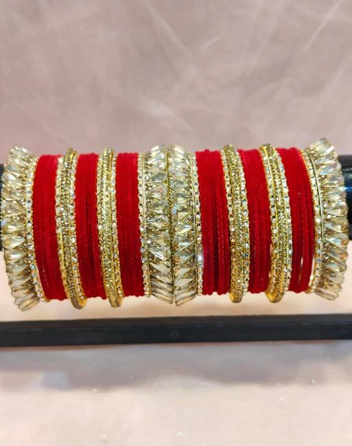 Checkout this latest Bracelet & Bangles
Product Name: *Women’s Beautiful And Stylish Traditional Design Chooda With Bright Beautiful Red Color*
Base Metal: Brass
Plating: Gold Plated
Stone Type: Kundan
Sizing: Non-Adjustable
Type: Chooda
Net Quantity (N): More Than 10
Sizes:2.4, 2.6, 2.8
Paatla presents bridal chooda set is artistically handcrafted by skilled artisans with smooth finishing that reflects ethnicity and grace.Standard grade Acrylic, brass, stones and kundan are used to made royal chudas set; it not only gives the traditional vibes but also ensures durability.Gift this beautiful Rajasthani Chudas set to women on her special or auspicious occasion. It will certainly adore the hands with its bright colors.Women love jewellery; specially Bangles adore a women. They wear it on different occasion. They have special importance on ring ceremony, wedding and festive time. They can also wear it on regular basics. Make your moment memorable with this range. This Bangle set features a unique one of a kind traditional embellish with Royal finish.
Country of Origin: India
Easy Returns Available In Case Of Any Issue


SKU: TILAK_CHOODA_R
Supplier Name: THAR BANGLES

Code: 995-113794864-008

Catalog Name: Princess Chic Bracelet & Bangles
CatalogID_33091516
M05-C11-SC1094