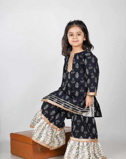 Checkout this latest Kurta Sets
Product Name: *Kids girls kurta with sharara set cotton kurti & sharara for party wear festive & traditional wear dress for baby girl (1-11 Years | Black)*
Top Fabric: Cotton
Dupatta: Without Dupatta
Top Shape: straight
Bottom Type: sharara
Top Length: calf length
Top Pattern: Printed
Sleeve Length: Long Sleeves
Product Details :- URBAN FLU Girls Pink & Navy Blue Animal Printed Pure Cotton Kurta with Sharara set || Pink elephant printed Kurta with Solid Blue Sharara || Kurta design:- Animal printed, Straight shape, Regular style, Round neck, Full sleeves, Above knee length with straight hem, Pure cotton & machine weave fabric || Sharara design: Solid Navy Blue Sharara, Elasticated waistband, Drawstring closure | Material & Care :- WASH SEPARATELY IN COLD WATER, DO NOT BLEACH, DRY IN SHADE, MEDIUM TO HOT IRON.,MADE IN INDIA || SPECIFICATION :- Sleeve Length :- Full Sleeves | Top Shape :- Straight | Top Type :-Kurta | Bottom Type :- Sharara | Top Pattern :- Gold Printed Kurta | Top Design Styling :- Regular | Top Hemline :- Straight | Top Length :- Above Knee | Neck :- Round Neck | Print or Pattern Type :- Animal Printed | Bottom Pattern :- Solid | Bottom Closure :- Drawstring | Waistband :- Elasticated | Weave Pattern :- Regular | Weave Type :- Machine Weave | Occasion :- Pair this stylish girls kids Kurta with sharara set with bangles & sandals that gives your kid an ethnic and beutifull look.
Sizes: 
3-4 Years
Country of Origin: India
Easy Returns Available In Case Of Any Issue


SKU: KIDS_BLACK_SHARARA
Supplier Name: KICK FASHIONS

Code: 154-117134672-999

Catalog Name: Fashionable Kurta Sets
CatalogID_34134342
M10-C32-SC1140