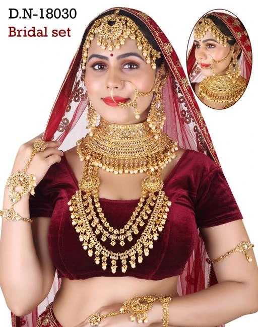 Checkout this latest Jewellery Set
Product Name: *Diva Fusion Jewellery Sets*
Base Metal: Alloy
Plating: Gold Plated
Stone Type: Pearls
Sizing: Adjustable
Type: Full Bridal Set
Net Quantity (N): 1
Traditional Kundan Dulhan Set /Bridal set  Wedding Jewellery .  high quality  traditional bridal jewelry combo necklace set is the best of accessories to enhance your beauty and compliment you on your wedding day.  Dulhan set /bridal set jewellery full set this set includes 1 Necklace, 1 Long Necklace, 1 Matha Patti, 1 PAir of earrings, 1 Pair of Hath Panja, 1 Bajubandh and 1 Nose Ring
Country of Origin: India
Easy Returns Available In Case Of Any Issue


SKU: 18030-Lct
Supplier Name: MATESHWARI ART JEWELLERY

Code: 8571-119068225-0054

Catalog Name: Diva Fusion Jewellery Sets
CatalogID_34768134
M05-C11-SC1093