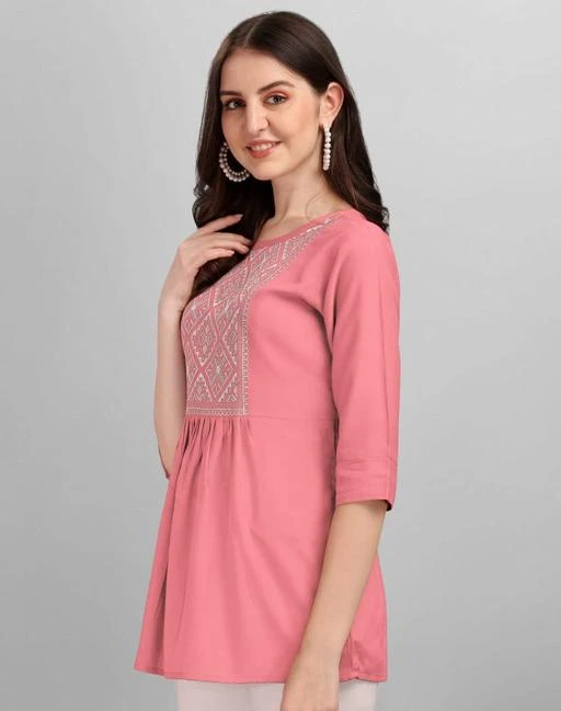 Checkout this latest Tops & Tunics
Product Name: *New stylish party wear EMBROIDERY TOPS for women with latest design readymade RAYON FABRIC for women’s tops and tunics for women latest stylish party wear tops embroidery tops for women*
Fabric: Rayon
Sleeve Length: Three-Quarter Sleeves
Pattern: Embroidered
Net Quantity (N): 1
Sizes:
S (Bust Size: 36 in, Length Size: 26 in) 
M (Bust Size: 38 in, Length Size: 26 in) 
L (Bust Size: 40 in, Length Size: 26 in) 
XL (Bust Size: 42 in, Length Size: 26 in) 
XXL (Bust Size: 44 in, Length Size: 26 in) 
WE BRINGS BRAND NEW WESTERN EMBROIDERY Women Tops & Tunics , So Update your wardrobe with this Rayon embroidered top, which is designed with half sleeves and V Collar-neck. Flaunt a chic look by teaming this top with skinny jeans and stilettoes. Casual Western TOP is ideal for the party, evening, etc. The TOP is made of Heavy Rayon14kg which is very light weight which feels very smooth on skin. 100% authorized quality assurance quality fabric at wholesale rate. Sizes - S,M,L,XL,XXL Fabric : 14 KG HEAVY SMOOTH RAYON Pattern : EMBROIDERY Care : 