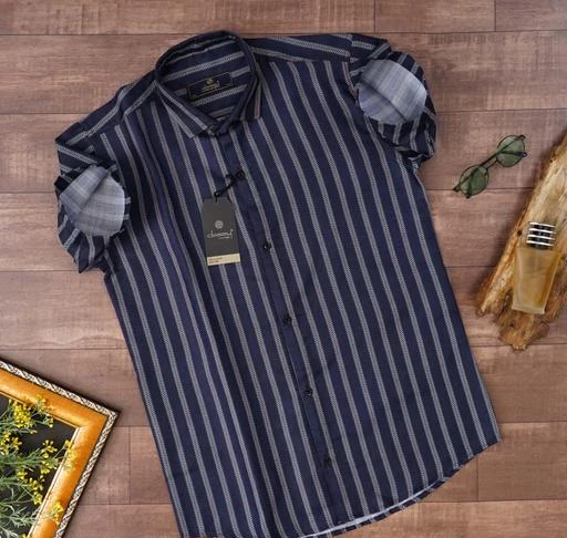 Checkout this latest Shirts
Product Name: *Premium Cotton Classy Vouge Casual Shirt's For Men*
Fabric: Cotton
Sleeve Length: Short Sleeves
Pattern: Striped
Net Quantity (N): 1
Sizes:
S (Chest Size: 38 in, Length Size: 27.5 in) 
M (Chest Size: 40 in, Length Size: 28 in) 
L (Chest Size: 42 in, Length Size: 29 in) 
XL (Chest Size: 44 in, Length Size: 30 in) 
XXL (Chest Size: 46 in, Length Size: 31 in) 
About the Brand Classy Vouge - Finding Basic Menswear for daily use can be hard among todays Over priced Fast fashion world, where trends change daily. That’s why we started Classy Vouge, to create a one stop shop for premium essential clothing for everyday use at lowest prices and bring Basics back in trend.
Country of Origin: India
Easy Returns Available In Case Of Any Issue


SKU: N-80
Supplier Name: CJERA Overseas

Code: 424-132744233-999

Catalog Name: Classy Modern Men Shirts
CatalogID_39148818
M06-C14-SC1206