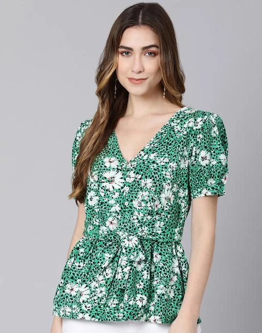 Checkout this latest Tops & Tunics
Product Name: *Pretty Graceful Women Tops & Tunics*
Fabric: Cotton
Sleeve Length: Short Sleeves
Pattern: Printed
Net Quantity (N): 1
Sizes:
S (Bust Size: 36 in, Length Size: 24 in) 
M (Bust Size: 38 in, Length Size: 24 in) 
L (Bust Size: 40 in, Length Size: 25 in) 
XL (Bust Size: 42 in, Length Size: 25 in) 
Get the radiant look with this Heaven on earth green color floral print women's top. Made with cotton fabric, this pure summary top has an all-over floral print, v-neckline along with a placket of a button and short sleeves. To peak up the look it has a tie-knot belt on the waist to highlight the waistline. This top has a super flexible fitting for all body types for a sleek look. Pair this with white or black color trousers and pants to get a graceful blossom look
Country of Origin: India
Easy Returns Available In Case Of Any Issue


SKU: S22563WBL002
Supplier Name: KPA Apparels Pvt Ltd

Code: 1201-141029486-9981

Catalog Name: Pretty Graceful Women Tops & Tunics
CatalogID_41869161
M04-C07-SC1020