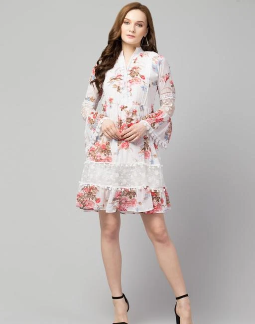 Checkout this latest Dresses
Product Name: *Women Fit and Flare White Dress*
Fabric: Georgette
Sleeve Length: Long Sleeves
Pattern: Printed
Net Quantity (N): 1
Sizes:
S (Bust Size: 36 in, Length Size: 37 in) 
M (Bust Size: 38 in, Length Size: 37 in) 
L (Bust Size: 40 in, Length Size: 37 in) 
Brand Name Nomi Indy Made
Style Decuration:-Pum Pum,Net & Less 
Pattern:-Floral Print 
Fabric:- Georgette
Pattern:- Solid Occasion: Casual || Party || Beach || Formal || Meeting || Office wear
Mukti Garments Self Manufacturing, and best price Nomi indy made brands not sell Local market, only sell online
?Size Chart in Inches -
?Size: S 
