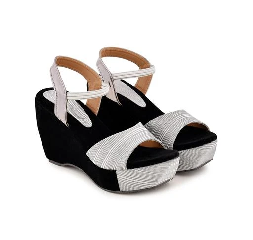Checkout this latest Heels
Product Name: *Ravishing Women Heels*
Material: Velvet
Sole Material: Pvc
Pattern: Embellished
Net Quantity (N): 1
Trendy women Black and Silver Velvet Wedge Heel Sandal
Sizes: 
IND-4 (Foot Length Size: 23 cm) 
IND-5 (Foot Length Size: 23.5 cm) 
IND-6 (Foot Length Size: 24 cm) 
IND-7 (Foot Length Size: 24.5 cm) 
IND-8 (Foot Length Size: 25 cm) 
Country of Origin: India
Easy Returns Available In Case Of Any Issue


SKU: EM-C1-515
Supplier Name: FASHION BEAT

Code: 674-43575418-997

Catalog Name: Ravishing Women Heels
CatalogID_10591153
M09-C30-SC2173
