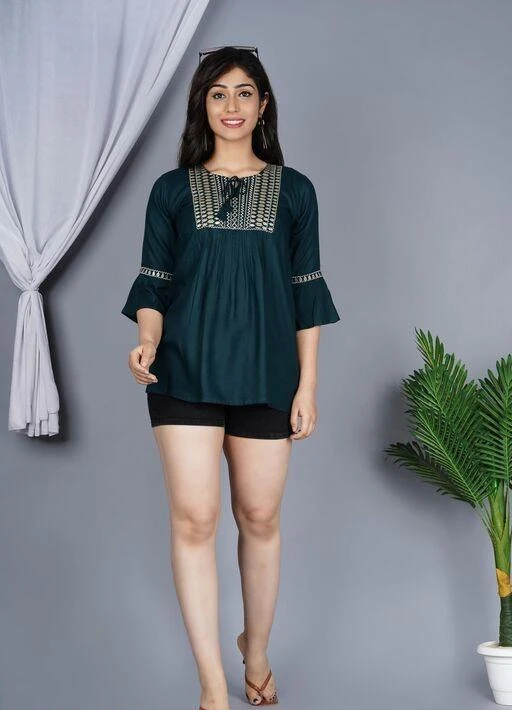 Checkout this latest Tops & Tunics
Product Name: *Classy Latest Women Tops & Tunics*
Fabric: Rayon
Sleeve Length: Three-Quarter Sleeves
Pattern: Embroidered
Multipack: 1
Sizes:
XS (Bust Size: 34 in, Length Size: 26 in) 
S (Bust Size: 36 in, Length Size: 26 in) 
M (Bust Size: 38 in, Length Size: 26 in) 
L (Bust Size: 40 in, Length Size: 26 in) 
XL (Bust Size: 42 in, Length Size: 26 in) 
Country of Origin: India
Easy Returns Available In Case Of Any Issue


Catalog Rating: ★3.8 (90)

Catalog Name: Trendy Latest Women Tops & Tunics
CatalogID_12388998
C79-SC1020
Code: 982-49631321-999
