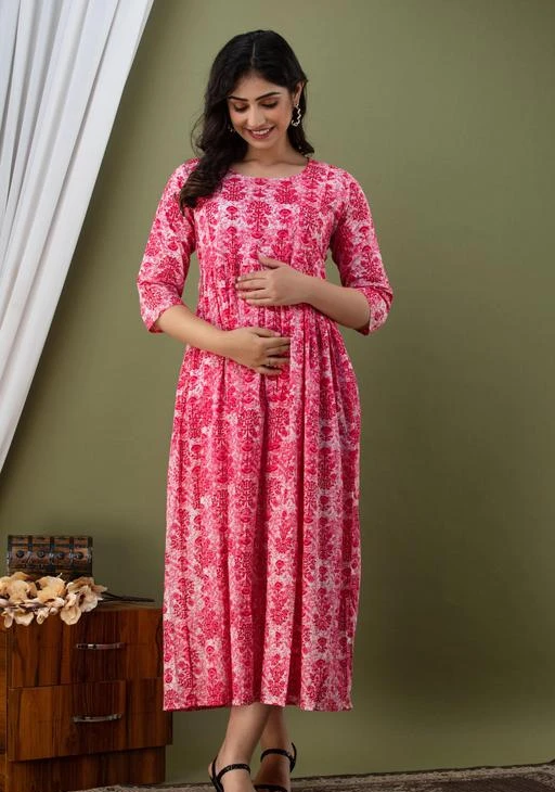 Checkout this latest Feeding Kurtis & Kurta Sets
Product Name: *Feeding Kurtis*
Fabric: Cotton
Bottom Type: No Bottomwear
Sleeve Length: Three-Quarter Sleeves
Fit/ Shape: Pleated
Pattern: Printed
Combo of: Single
This kurta is a 49inch length kurta with 3/4th sleeves and lace at the edge, and wooden buttons in front for opening, not just for show. This long kurta has two chains in the front for breast feeding. and this kurta has the best cotton fabric which is super comfortable for the women and baby.
Sizes: 
M (Bust Size: 38 in) 
L (Bust Size: 40 in) 
XL (Bust Size: 42 in) 
XXL (Bust Size: 44 in) 
Country of Origin: India
Easy Returns Available In Case Of Any Issue


SKU: FCMATTR-PINK
Supplier Name: MN Creations

Code: 354-52777108-0081

Catalog Name: feeding kurtis
CatalogID_13353739
M04-C53-SC2330