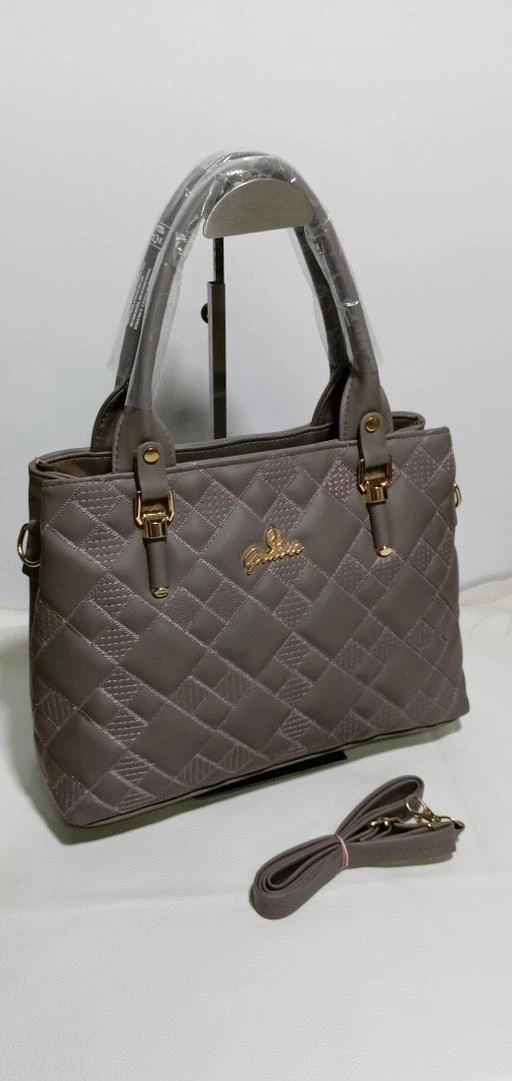 Checkout this latest Handbags
Product Name: *Elite Fashionable Women Handbags*
Material: Faux Leather/Leatherette
No. of Compartments: 2
Pattern: Quilted
Type: Handheld
Multipack: 1
Sizes:Free Size (Length Size: 5 in, Width Size: 15 in, Height Size: 9 in) 
Country of Origin: India
Easy Returns Available In Case Of Any Issue


Catalog Rating: ★4.6 (5)

Catalog Name: Elite Fashionable Women Handbags
CatalogID_13874754
C73-SC1073
Code: 915-54421483-078