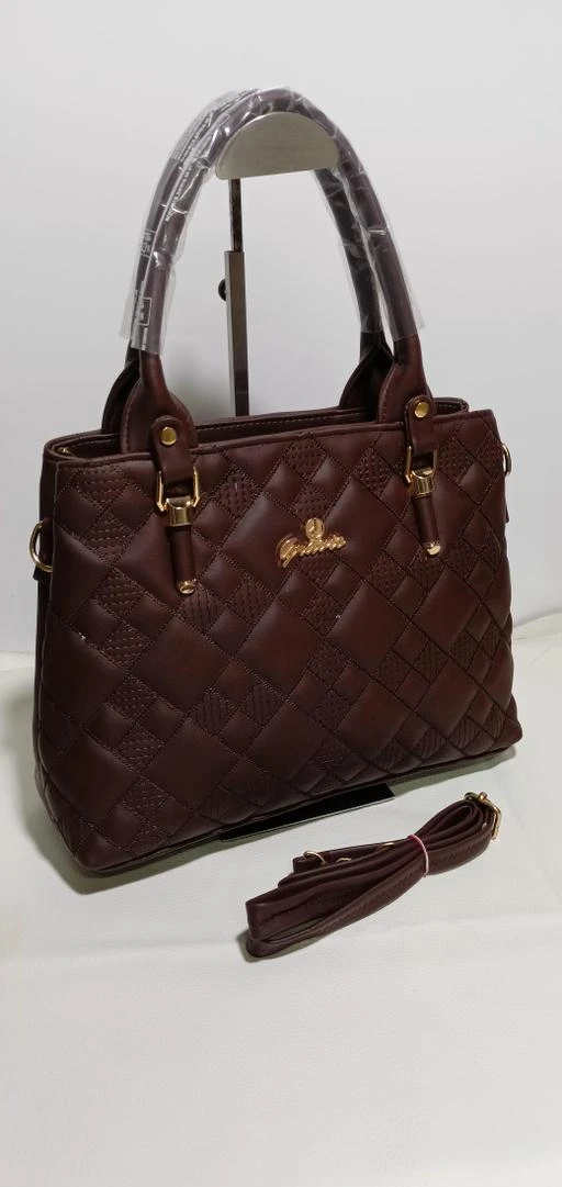 Checkout this latest Handbags
Product Name: *Elite Fashionable Women Handbags*
Material: Faux Leather/Leatherette
No. of Compartments: 2
Pattern: Quilted
Type: Handheld
Multipack: 1
Sizes:Free Size (Length Size: 5 in, Width Size: 15 in, Height Size: 9 in) 
Country of Origin: India
Easy Returns Available In Case Of Any Issue


Catalog Rating: ★4 (8)

Catalog Name: Elite Fashionable Women Handbags
CatalogID_13874754
C73-SC1073
Code: 025-54421484-078