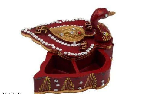 Checkout this latest Festive Bowl & Spoons
Product Name: *Roli Tika Chopra in Peacock Shape Meenakari Work/Kumkum Box (Red) Festive Bow*
Wooden red embossed meenakari kundan studded roli chopra in Peacock Shape, elegant shaped in red color traditional spiritual decorative showpiece item handmade. These Kumkum Box Are Safe To Use And Long Lasting. A Must Buy Product For Puja, Marriages And Other Festival Celebrations. It has a Swastik design over chopra. This beautiful pieceMade From Premium Quality Material.
Country of Origin: India
Easy Returns Available In Case Of Any Issue


SKU: e5uWd2m-
Supplier Name: DECOR & DESIGN

Code: 302-55219510-052

Catalog Name: Attractive Festive Bowl 
CatalogID_14137663
M08-C25-SC1315