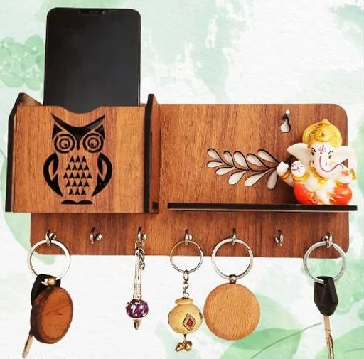 Checkout this latest Key Holders
Product Name: *Ishu Handiartistic Wooden wall mounted Stylish Owl design key Holder and pen stand I Wooden stand for Wall of Home, Offices ,Kitchen , Living room décor II Stylish Key organizer with hooks  II Key Ring holder II Key Rack*
Material: Wooden
Color: Brown
Product Length: 25 cm
Product Height: 16 cm
Product Breadth: 5 cm
Net Quantity (N): 1
Ishu Handiartistic presents stylish wooden Owl design key holder with Pen and mobile shelf with attractive designs .Key holder is like a small hanger, usually attached to the wall or at the entrance to the door, where keys can be hung. It is also sometimes referred to as a “key wall holder”, a “key hook,” a “key rack” or a “key ring holder”.The main purpose of key holders is to organize and store all the important keys in one place and within your eyesight. As functional as it may be, key holders can also add an aesthetic dimension to a wall or an entryway.The dimensions of this keyholder is approx 11