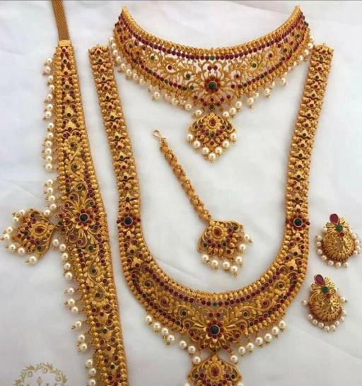 Checkout this latest Jewellery Set
Product Name: * Jewellery Set *
Base Metal: Alloy
Plating: Gold Plated - Matte
Stone Type: Pearls
Sizing: Adjustable
Type: As Per Image
Net Quantity (N): 1
Product Details: 1 Long Necklace, 1 Choker Necklace Set, 1 Pair Earrings, 1 Maang Tikka, 1 Kamarband Dimension : 1 Long Necklace 30 Cms, 1 Earrings 4 Cms, Kamarband – 29 Cms, Tikka 2 Inches • Double Quality Check passed Superior quality and skin friendly: high quality as per both domestic and international standards that makes it perfectly fall on the body with no allergy to the skin. it has been made from toxic free materials anti-allergic and safe for skin. it can be worn over long time periods without any complains such as itching, rashes and swelling. Manufactured by Highest and premium quality material this product assures to remain in its original glory even after years of usage. • Lifetime Gift : An ideal Wedding, valentine, birthday, anniversary gift your loved ones. women love jewellery; specially traditional jewellery adore a women. they wear it on different occasion they have huge significance on, wedding, engagement, anniversary and
Country of Origin: India
Easy Returns Available In Case Of Any Issue


SKU: nagneshi-6216
Supplier Name: NAGNESHI ART

Code: 317-63058003-9953

Catalog Name: Twinkling Chic Jewellery Sets
CatalogID_16751498
M05-C11-SC1093