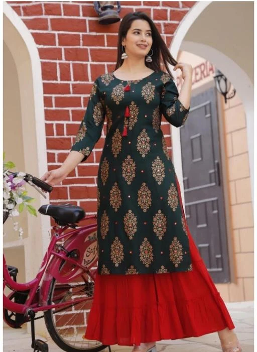 Checkout this latest Kurta Sets
Product Name: *FALAK GARMENTS  PREMIUM PRINTED RAYON ALISHA-KURTA  SHARARA  SET FALAK NEWLOOK (GREEN-RED)*
Kurta Fabric: Rayon
Bottomwear Fabric: Rayon
Fabric: Rayon
Sleeve Length: Three-Quarter Sleeves
Set Type: Kurta With Bottomwear
Bottom Type: Sharara
Pattern: Printed
Net Quantity (N): Single
Sizes:
M, L, XL, XXL, XXXL
FALAK GARMENTS  A good quality ethnic set for women. It will give them a classic and trendy look.This is made as per the latest trends to keep you in sync with high fashion and with wedding and other occasion, it will keep you comfortable all day long. The lovely design forms a substantial feature of this wear.
Country of Origin: India
Easy Returns Available In Case Of Any Issue


SKU: ALISHA-KURTA SHARARA SET FALAK NEWLOOK
Supplier Name: FALAK GARMENTS

Code: 444-67592546-9931

Catalog Name: Banita Alluring Women Kurta Sets
CatalogID_18225047
M03-C04-SC1003