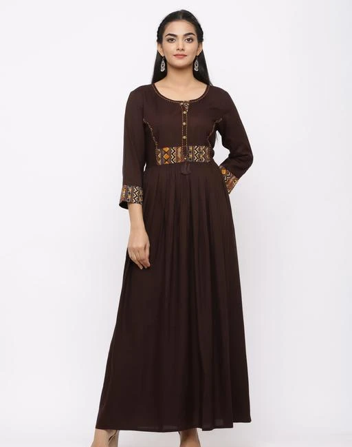 Checkout this latest Gowns
Product Name: *Charu Women's Rayon Printed Anarkali Long Dress (Brown)*
Fabric: Rayon
Sleeve Length: Three-Quarter Sleeves
Pattern: Printed
Multipack: 1
Sizes:
S (Bust Size: 36 in, Length Size: 54 in) 
M (Bust Size: 38 in, Length Size: 54 in) 
L (Bust Size: 40 in, Length Size: 54 in) 
XL (Bust Size: 42 in, Length Size: 54 in) 
Country of Origin: India
Easy Returns Available In Case Of Any Issue


Catalog Rating: ★4.3 (82)

Catalog Name: Urbane Partywear Women Gowns
CatalogID_1187594
C79-SC1289
Code: 334-7397355-9991