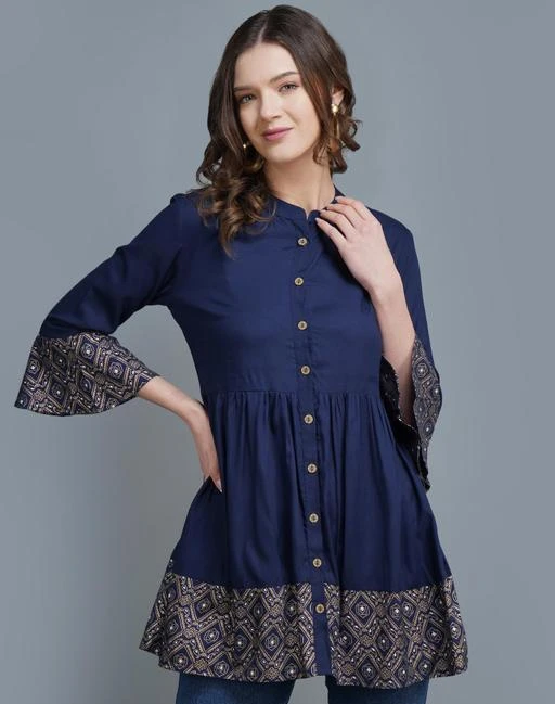 Checkout this latest Tops & Tunics
Product Name: *Pretty Ravishing Women Tops & Tunics*
Fabric: Rayon
Sleeve Length: Three-Quarter Sleeves
Pattern: Printed
Multipack: 1
Sizes:
S (Bust Size: 36 in, Length Size: 28 in) 
M (Bust Size: 38 in, Length Size: 28 in) 
L (Bust Size: 40 in, Length Size: 28 in) 
XL (Bust Size: 42 in, Length Size: 28 in) 
XXL (Bust Size: 44 in, Length Size: 28 in) 
Country of Origin: India
Easy Returns Available In Case Of Any Issue


SKU: 9030BLUE-TOP
Supplier Name: Nidhi Creation_JPR

Code: 063-75087799-9941

Catalog Name: Pretty Ravishing Women Tops & Tunics
CatalogID_20805995
M04-C07-SC1020