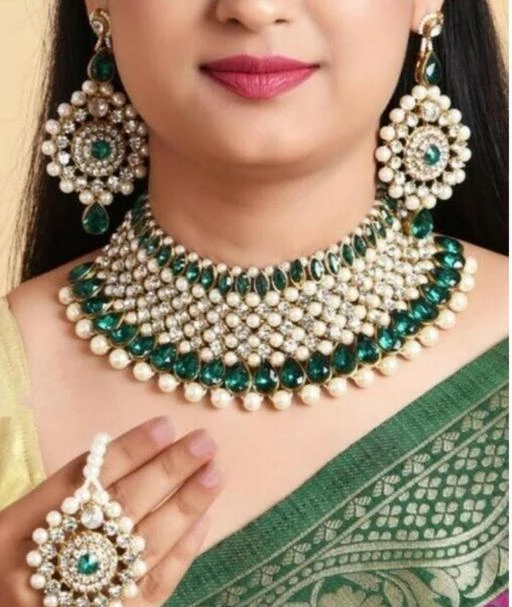 Checkout this latest Jewellery Set
Product Name: *Choker jewellery set*
Base Metal: Alloy
Plating: Gold Plated
Stone Type: Cubic Zirconia/American Diamond
Sizing: Adjustable
Type: Necklace Earrings Maangtika
Net Quantity (N): 1
Saiart Jewellery brings to you the beautiful & Traditional Jewellery are the identity of Indian women and a symbol of grace. They have special importance on ring ceremony, wedding and festive time, festivals and celebrations are part of Indian culture and women like to traditionally dress themselves with latest trends in jewellery and Saiart Jewellery Fulfil them, Ideal Valentine, Birthday and Anniversary gift for someone you LOVE kundan choker jewellery set necklace kundan chokers choker set bridal jewelry bridel sets for wedding red necklaces long combo kundan bridal jewellery  kundan bridal necklace set kundan bridal jewellery sets Green for wedding premium kundan bridal set Specially Designed For this jewellery can be used for multiple events, occasions & ceremonies like festivals, mehndi, haldi, sangeet, engagement, wedding, reception, baby shower, party or fashion shows. multi-color jewellery, minimal jewellery, traditional or ethnic jewellery, statement jewellery, contemporary jewellery, trendy, stylish & fancy jewellery, work wear jewellery, western jewellery it can also be best pick for gifting.
Country of Origin: India
Easy Returns Available In Case Of Any Issue


SKU: RC9pp_4V
Supplier Name: sai art Jewellery

Code: 992-76642388-005

Catalog Name: Feminine Chunky Jewellery Sets
CatalogID_21325384
M05-C11-SC1093