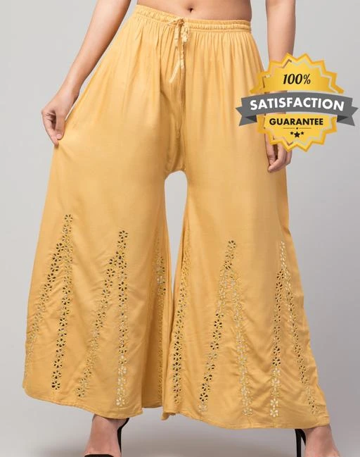 Checkout this latest Palazzos
Product Name: *TRENDY MIRROR WORK PALAZZO SKIN 15*
Fabric: Rayon
Pattern: Embellished
Net Quantity (N): 1
TRENDY ERA-Focus on Quality of its product,Minimum Waist(Relaxed Elastic)=28 inches,Maximum Waist(Stretched Elastic)=42 inches I Fabrify aims at delivering topmost premium Quality Women's fashion bottoms at competitive price which is affordable by women of all age. Add these has Designed Palazzo With Extra Soft,Which is truly a Comfort Wear.it enhances your curve line,that makes it is a perfect statement of style and comfort.fabric rayon pattern rayon mirror work wastern wear palazzo and good quality. Search and follow my shop 