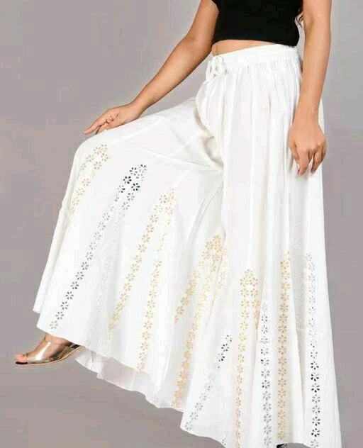Checkout this latest Palazzos
Product Name: *RamaApparels Trending stylish star Palazzo*
Fabric: Rayon
Pattern: Embellished
Net Quantity (N): 1
 Rama Apparels Focus on Quality of its product, Minimum Waist (Relaxed Elastic) 28 inches, Maximum Waist (Stretched Elastic 40 inches , Fabrify aims at delivering topmost premium Quality Women's fashion bottoms at competitive price which is affordable by Women of all age. Add these has Designed Palazzo With Extra Soft , Which is truly a Comfort Wear . it enhances your curve line,that makes it is a perfect statement of style and comfort . fabric rayon, patterns star shaped mirror and good Quality .
Sizes: 
28 (Waist Size: 28 in, Length Size: 40 in) 
30 (Waist Size: 30 in, Length Size: 40 in) 
32 (Waist Size: 32 in, Length Size: 40 in) 
34 (Waist Size: 34 in, Length Size: 40 in) 
36 (Waist Size: 36 in, Length Size: 40 in) 
38 (Waist Size: 38 in, Length Size: 40 in) 
40 (Waist Size: 40 in, Length Size: 40 in) 
42, 44, 46
Country of Origin: India
Easy Returns Available In Case Of Any Issue


SKU: RamaApp_StarPalazzo_white
Supplier Name: RamaApparels

Code: 953-91574631-998

Catalog Name: Casual Unique Women Palazzos
CatalogID_26149081
M04-C08-SC1039